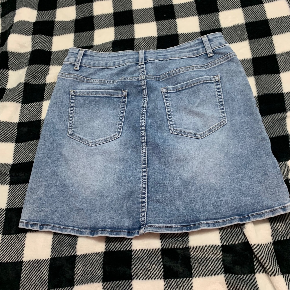 Girl’s short blue jean skirt